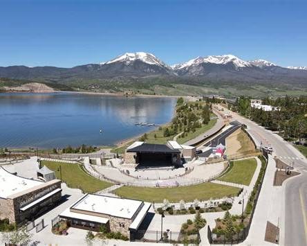 Dillon Amphitheater with Lake Dillon and snow-capped peaks behind it